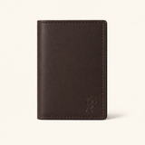 The Rancher's Legacy brown leather cardholder wallet with embossed cowboy logo, smooth leather finish, and reinforced edge stitching.