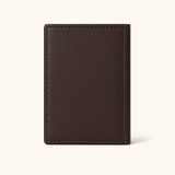 Back view of The Rancher's Legacy brown men's leather cardholder with smooth full-grain texture, slim profile, and precise edge stitching.