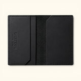 Open interior of The Rancher's Legacy black RFID leather cardholder showing slim card pockets, embossed Western Leather Goods branding, and textured center lining.