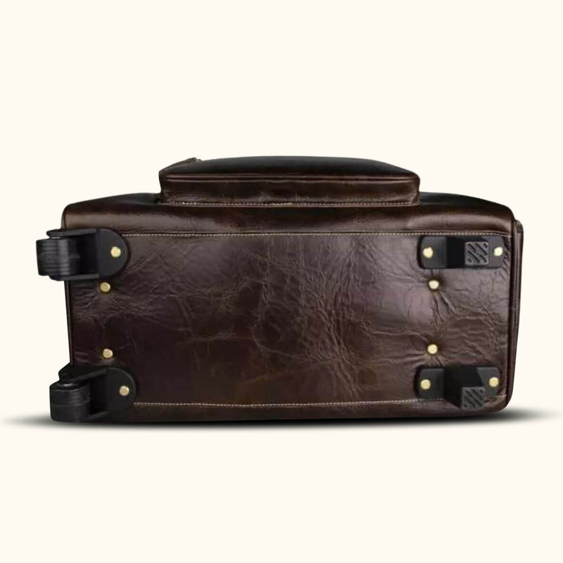 Effortless travel sophistication awaits with a rolling duffle bag in luxurious leather, combining style and practicality.