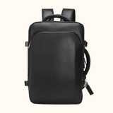 The Stetson Peak - Expandable Men's Leather Backpack in black, front view displaying the sleek and minimalistic design with smooth leather surface and secure zippers.