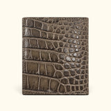 The Compact Crocodile Wallet in taupe green showing the natural crocodile scale pattern on the back exterior