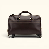 Back view of The Lawful Leather Duffle with Wheels featuring a clean full-grain leather panel, reinforced carry handles, smooth rolling wheels, and premium handcrafted construction.