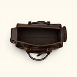 The Lawful Leather Duffle with Wheels open top view showcasing a spacious main compartment, interior zip pocket, premium lining, and wide opening for easy packing and travel organization.
