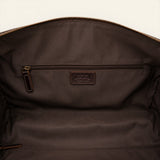 Interior of The Lawful Leather Duffle with Wheels featuring a spacious main compartment, secure zippered pocket, durable fabric lining, and embossed Western Leather Goods logo patch.