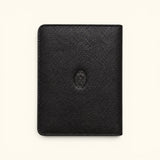The Western Traveler black leather passport holder, front view with pebbled texture, stitched edges, and cowboy emblem.