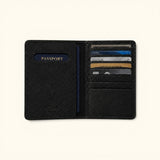 The Western Traveler black leather passport holder, open interior view with passport and cards inserted into the storage slots.