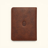 The Western Traveler brown leather passport holder, front view with pebbled texture, stitched edges, and cowboy western emblem.