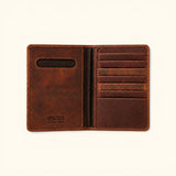 The Western Traveler brown leather passport holder, open interior view showing multiple card slots, passport pocket, and Western Leather Goods embossing.