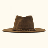 Front view of The Trailsman – a brown suede Western hat with a wide flat brim, eyelets on the crown, and a braided leather band with a metal concho.