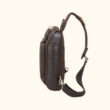Side view of the Trailblazer Trekker Vintage Leather Chest Pack USB charger