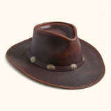 Side angled view of the Walker full-grain leather hat featuring antique concho band and classic Aussie-Western brim